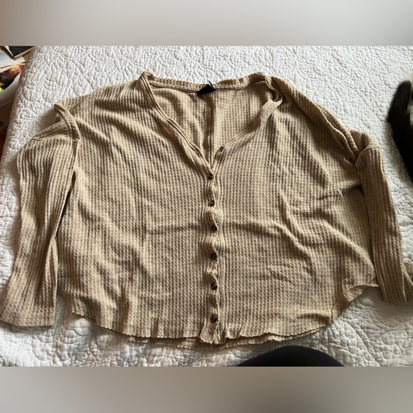 out from under button up sweater. - Picture 1 of 3